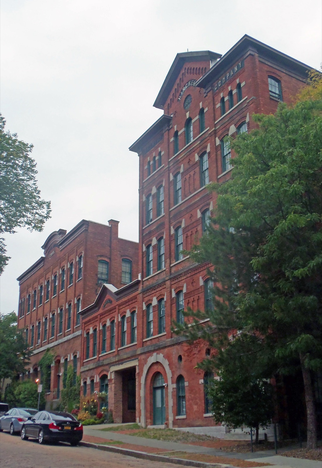 Four-story red brick industrial building with arched windows on Park Avenue, Albany